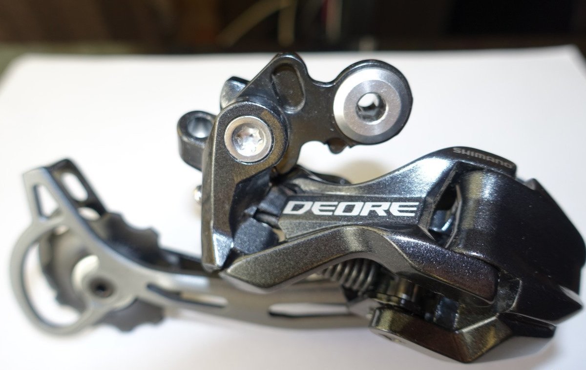 Задний переключатель shimano deore 9. Shimano deore rd-m592. rd-m592-sgs. переключатель shimano deore m6000. shimano deore rd-m6000.
